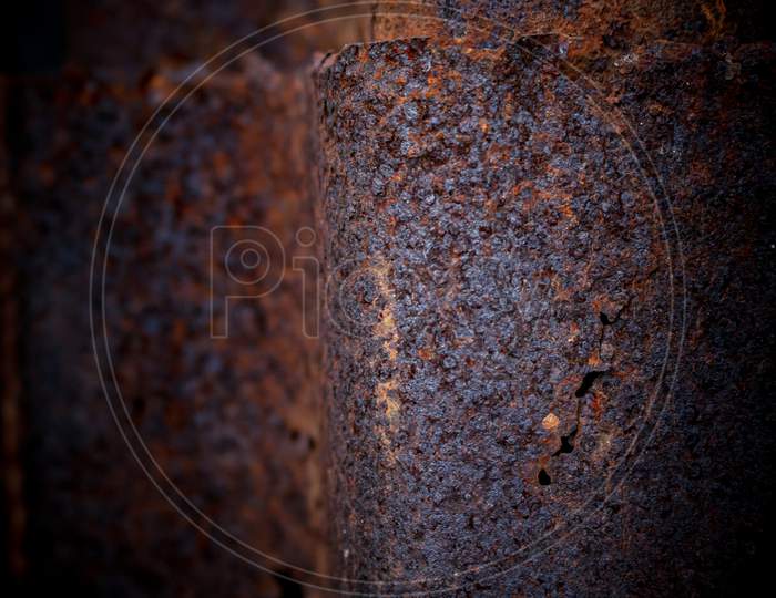 Detail View Of Old Rusty Corrugated Metal Sheet. Old Corrugated Iron Sheet Of Brown Color With Numerous Traces Of Rust, Texture Background.