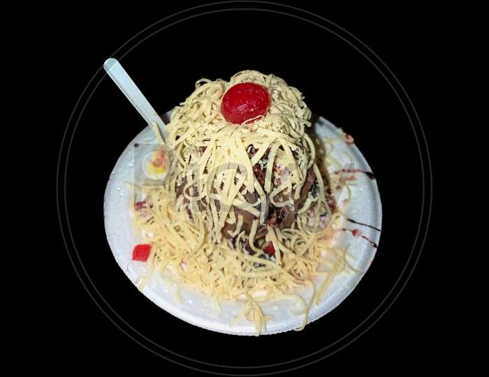 Indian Ice Gola dish in black background.