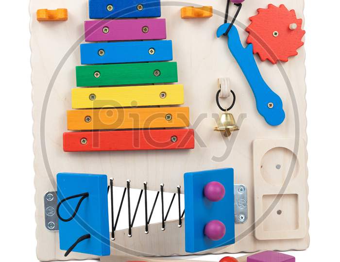 Wooden Toy Busybord For Little Kids Up To 1 Year: Multi-Colored Doors With A Latch, Xylophone, Bell, Multi-Colored Buttons, Gears, Educational Toy For For The Development Of Children