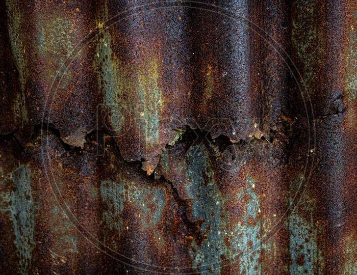 Old And Rusty Grunge Corrugated Iron, Texture Background. Detail View Of Old Rusty Corrugated Metal Sheet.