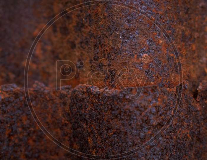 Grunge Rusted Corrugated Galvanized Iron Background Texture. Detail View Of Old Rusty Corrugated Metal Sheet.
