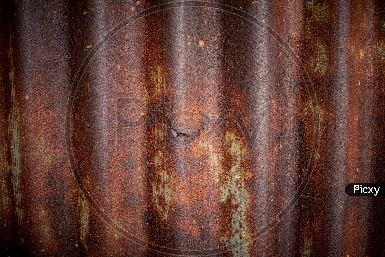 Old Corrugated Iron Sheet Of Brown Color With Numerous Traces Of Rust, Texture Background.