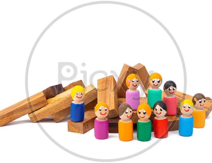 Wooden Eco-Toys Standing On Different Levels Of Wooden Steps On A White Isolated Background