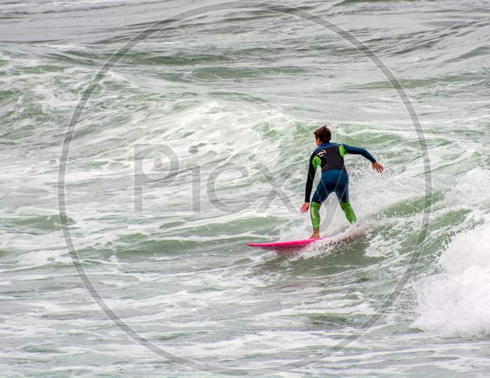 Bude, Cornwall/Uk - August 13 : Surfing At Bude In Cornwall On August 13, 2013. Unidentified Person