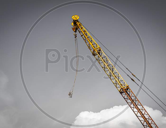 Close-Up Of A Cargo Crane Against The Sky.Conception Of Storage Of Goods By Importers, Exporters, Wholesalers, Transport Enterprises, Customs
