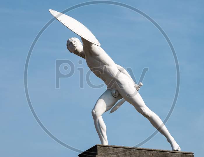 Statue Of A Naked Male Warrior At The Charlottenburg Palace In Berlin