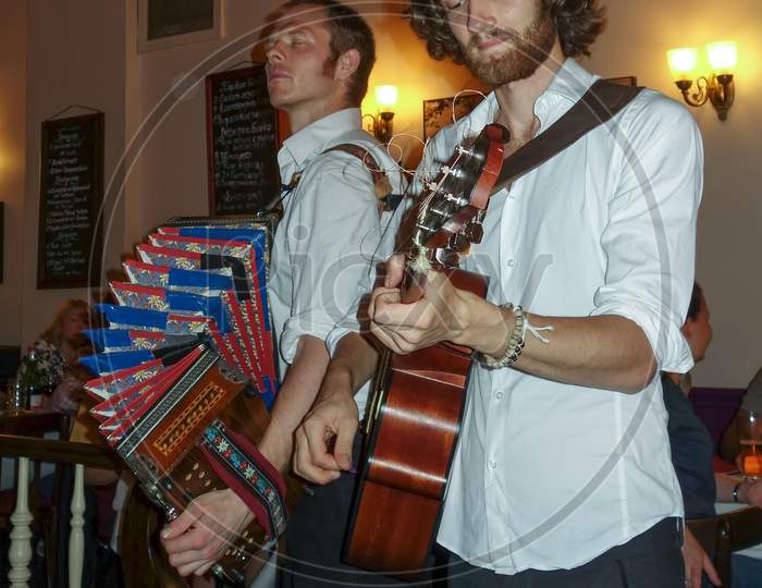 Folk Singers In A Restaurant In Berlin