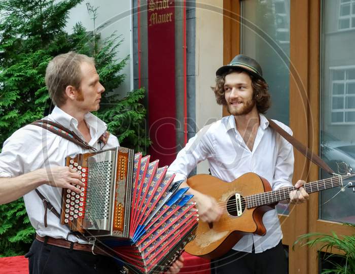 Folk Singers Outside A Restaurant In Berlin