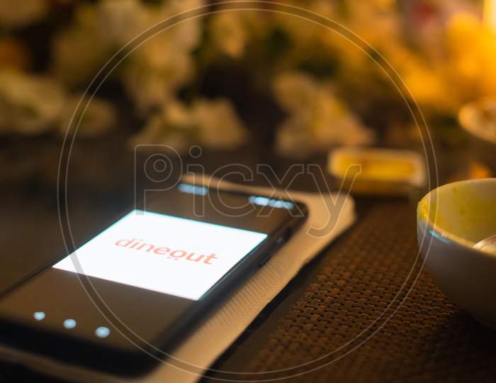 Mobile Phone With The Foodtech App Startup Dineout Open Offering Discounts, Payment And Options Of The Best Eating Places In India