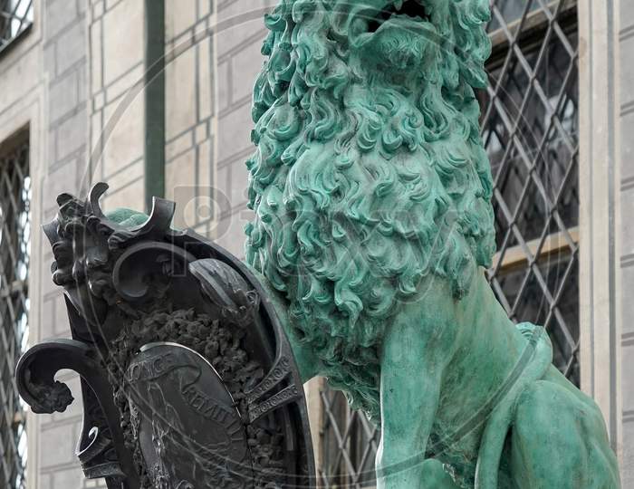 Statue Of  A Green Lion At Odeonsplatz In Munich