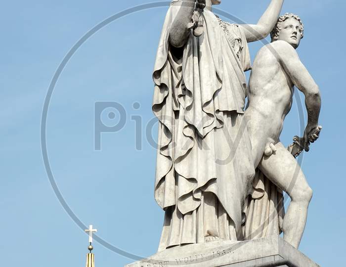 Statue Of Young Man Led To A New Battle By Athena On The Castle Bridge In Berlin