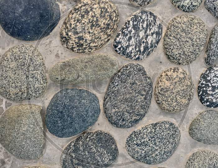 Round River Stones Wall Background Texture