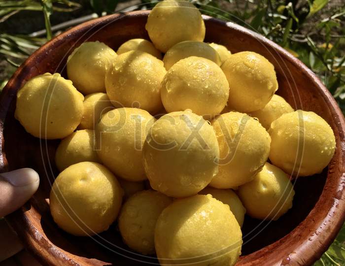 Lemons In A Wooden Bowl Close View