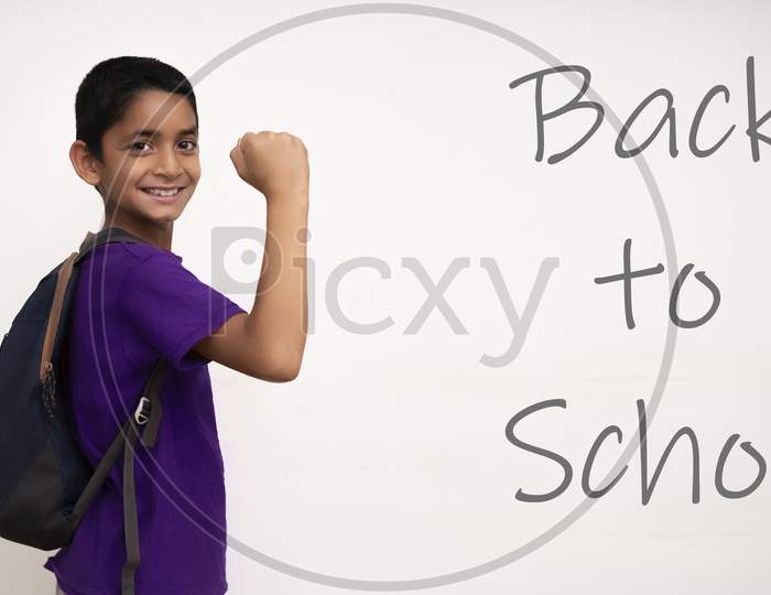 Young Indian Kid Feeling Happy While Going Back To School. Back To School After Corona Virus Concept