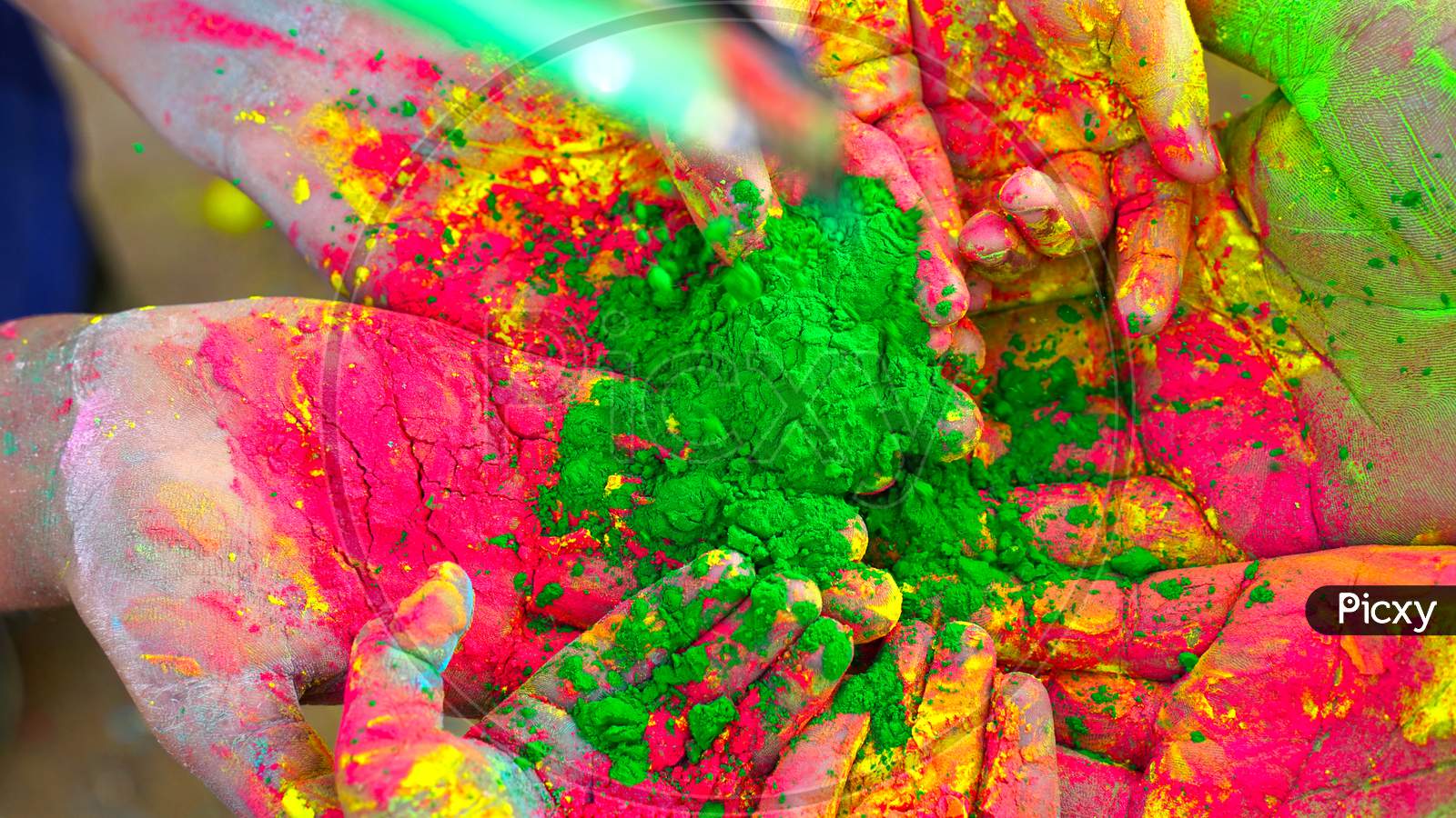 A picture of splash of colour powder in a holi festival in india