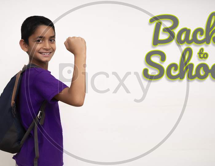 Young Indian Kid Feeling Happy While Going Back To School. Back To School After Corona Virus Concept