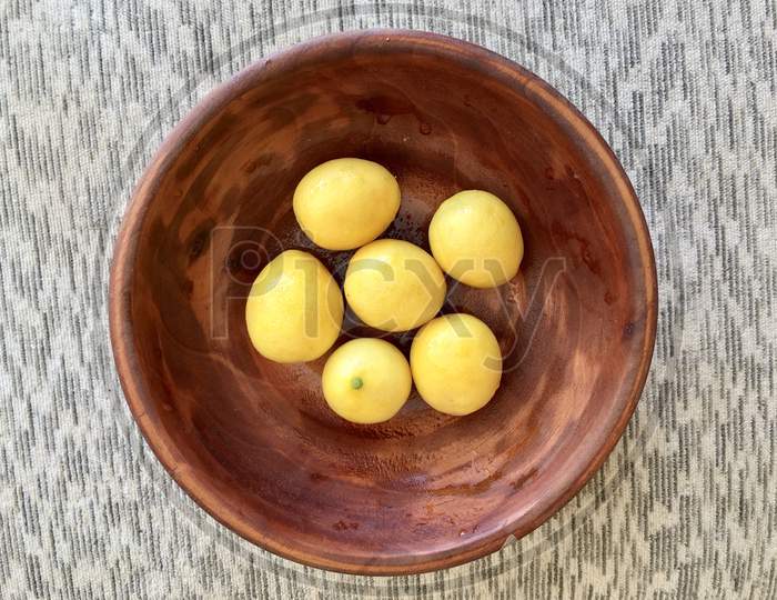 Yellow Ripe Lemons In Bowl