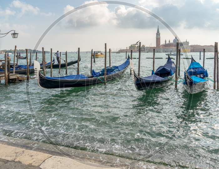 Gondolas Moored At The Entrance To The Grand Canal