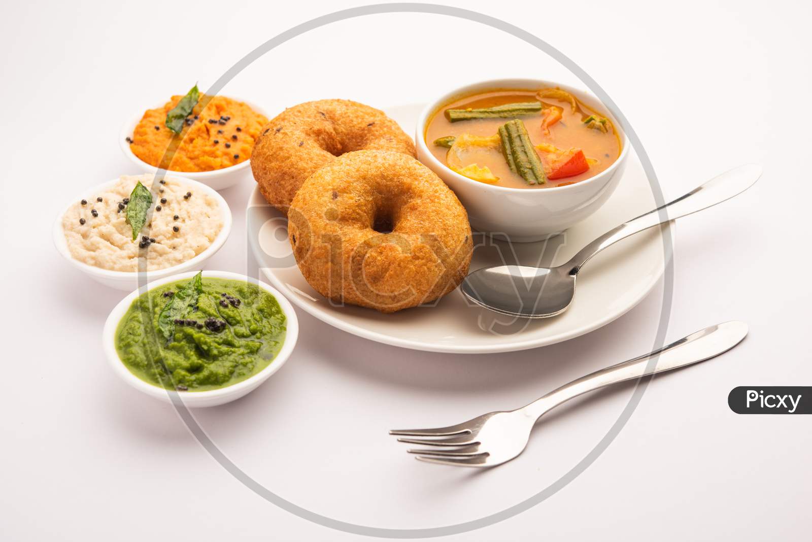 Medu Vada Or Sambar Vada, A Popular South Indian Food Served With Different Chutney