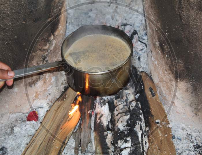 tea making in indian wooden chula