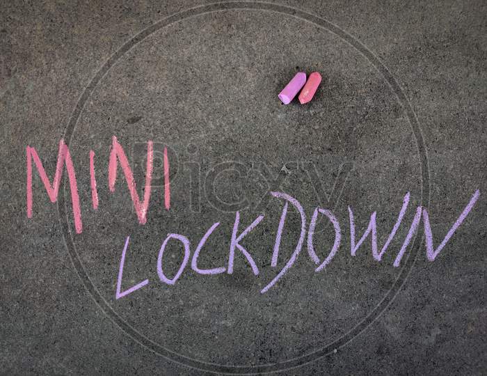 The Inscription Text On The Grey Board, Mini Lockdown . Using Color Chalk Pieces.