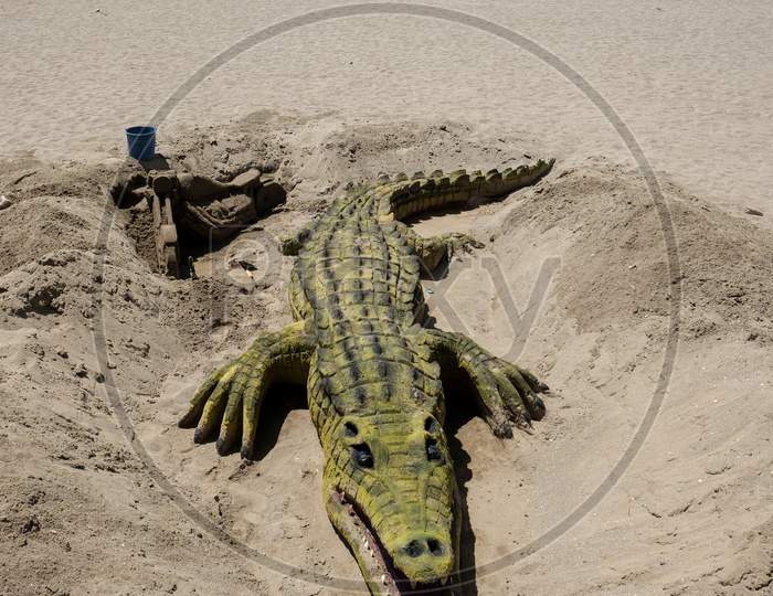 Crocodile Sand Sculpture On The Beach In Marbella