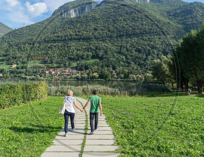Couple On A Walk Around Lake Endine Near Bergamo