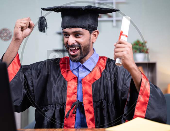 Young Man Excited Over Announcing Graduation Names Over Video Call While Holding Certificate - Concept Virtual Graduation New Normal Due To Covid-19 Coronavirus Safety Measures.