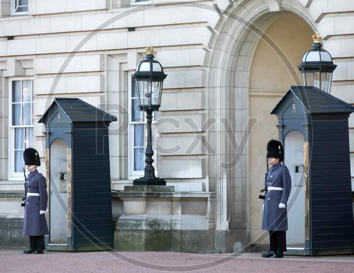 Guards In Greatcoats On Sentry Duty At Buckingham Palace