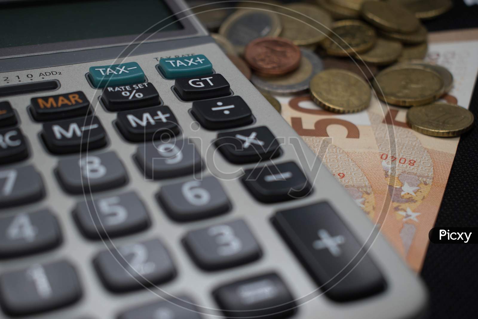 Close Up Of Calculator Near Tax Sign And Euro Currency, Coins, Banknotes.