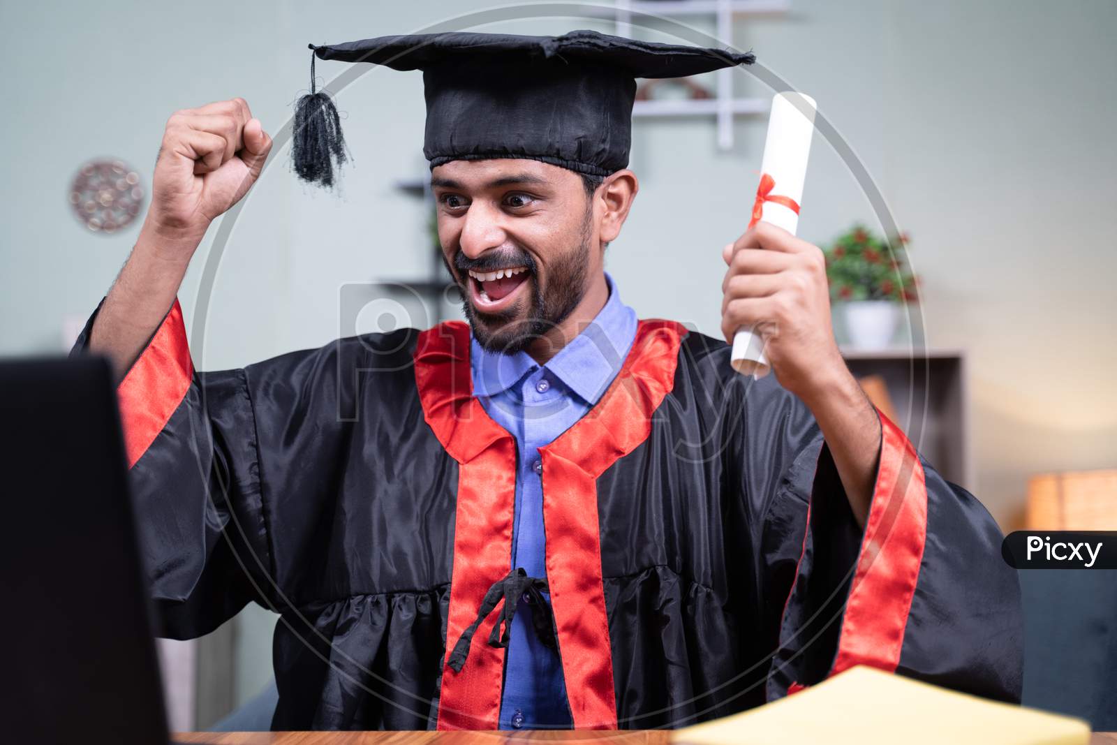 Young Man Excited Over Announcing Graduation Names Over Video Call While Holding Certificate - Concept Virtual Graduation New Normal Due To Covid-19 Coronavirus Safety Measures.