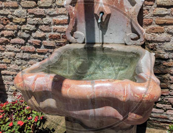 View Of A Fountain In The Alcazaba Fort And Palace Gardens In Malaga