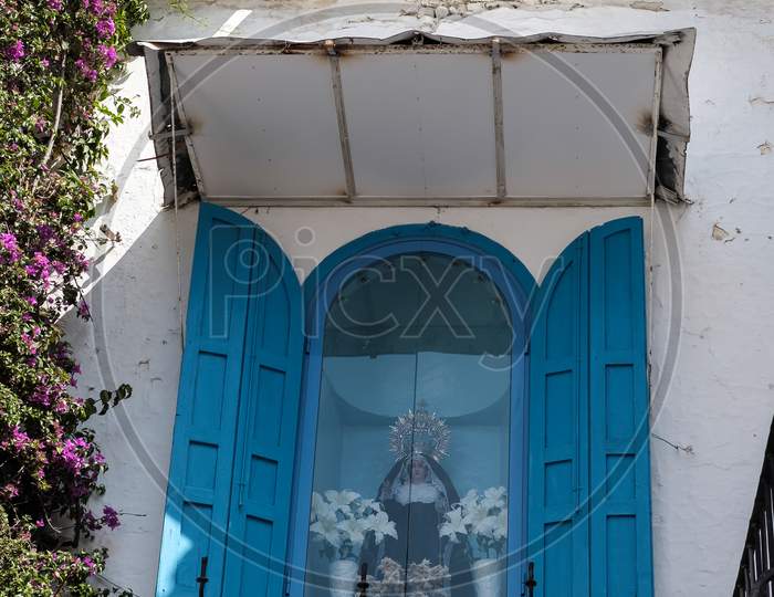 Madonna Statue In A Window In Marbella Spain