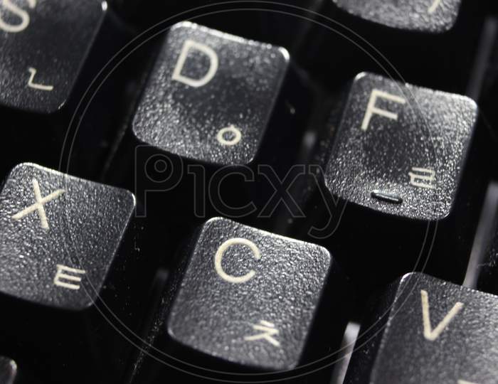 Closeup Of Laptop Computer Keyboard Black Keys With White Letters And Numbers