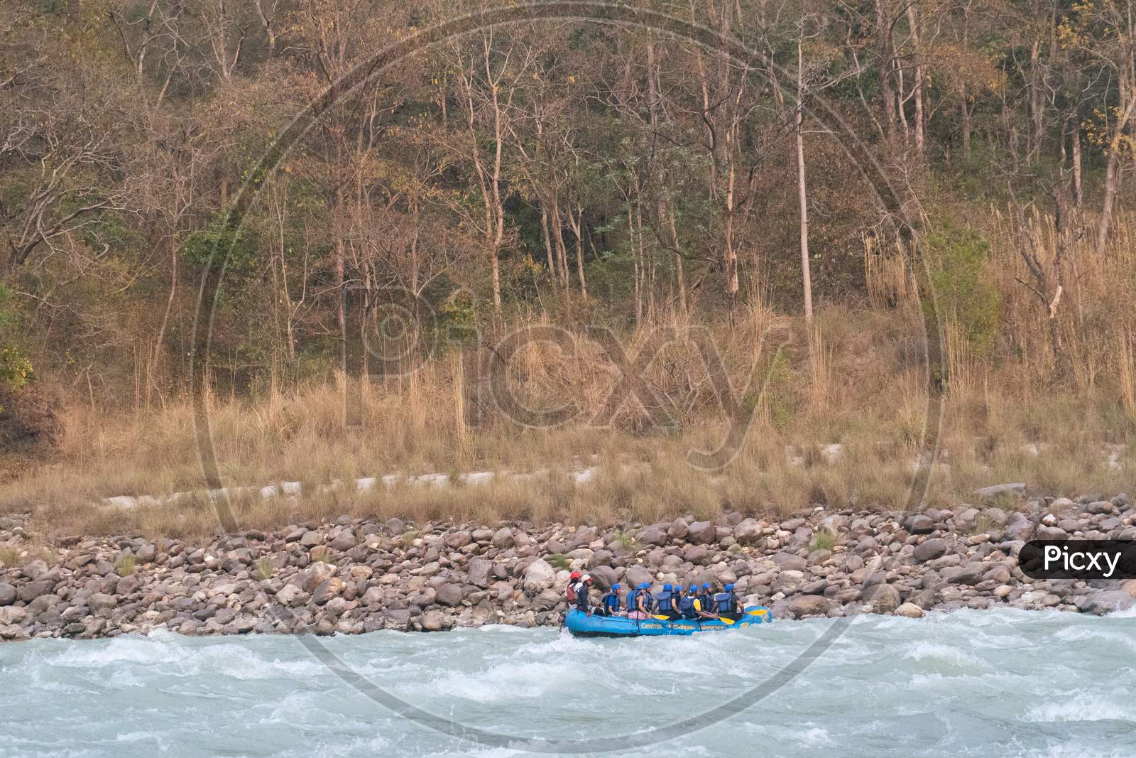 the rafting boat moves in its motion with the waves of water while river rafting in rishikesh uttarakhand, India