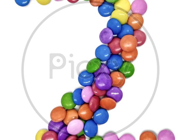 Beautiful Candy Gems on White in the shape of  Numbers, Colored sugar coated fennel seed isolated on white