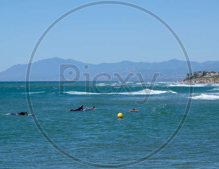 Cabo Pino, Andalucia/Spain - July 2 : People Surfing At Cabo Pino Andalucía Spain On July 2, 2017. Unidentified People.