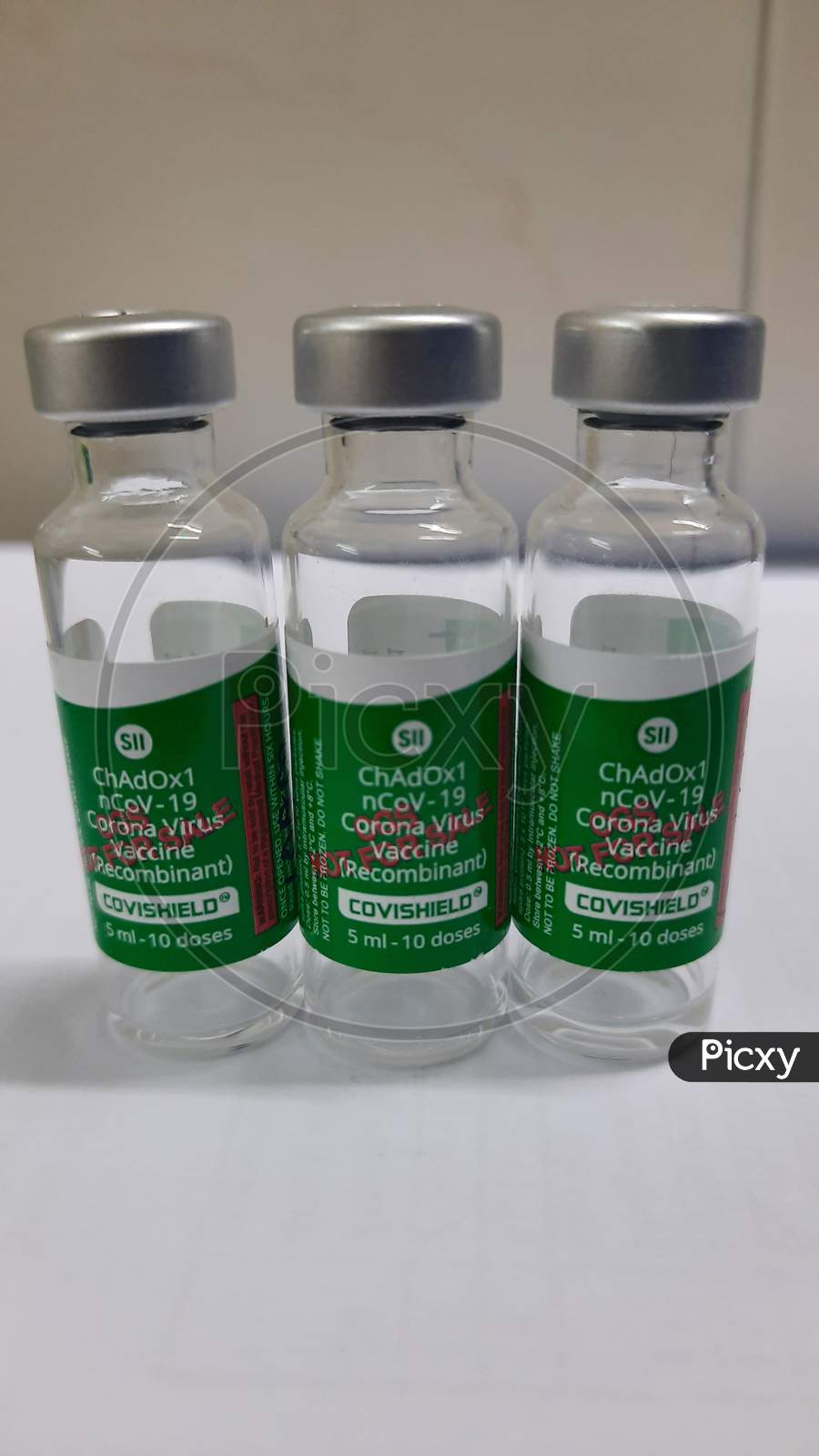 Closeup Photo Of Three Covishield Vaccine Vials In White Background.