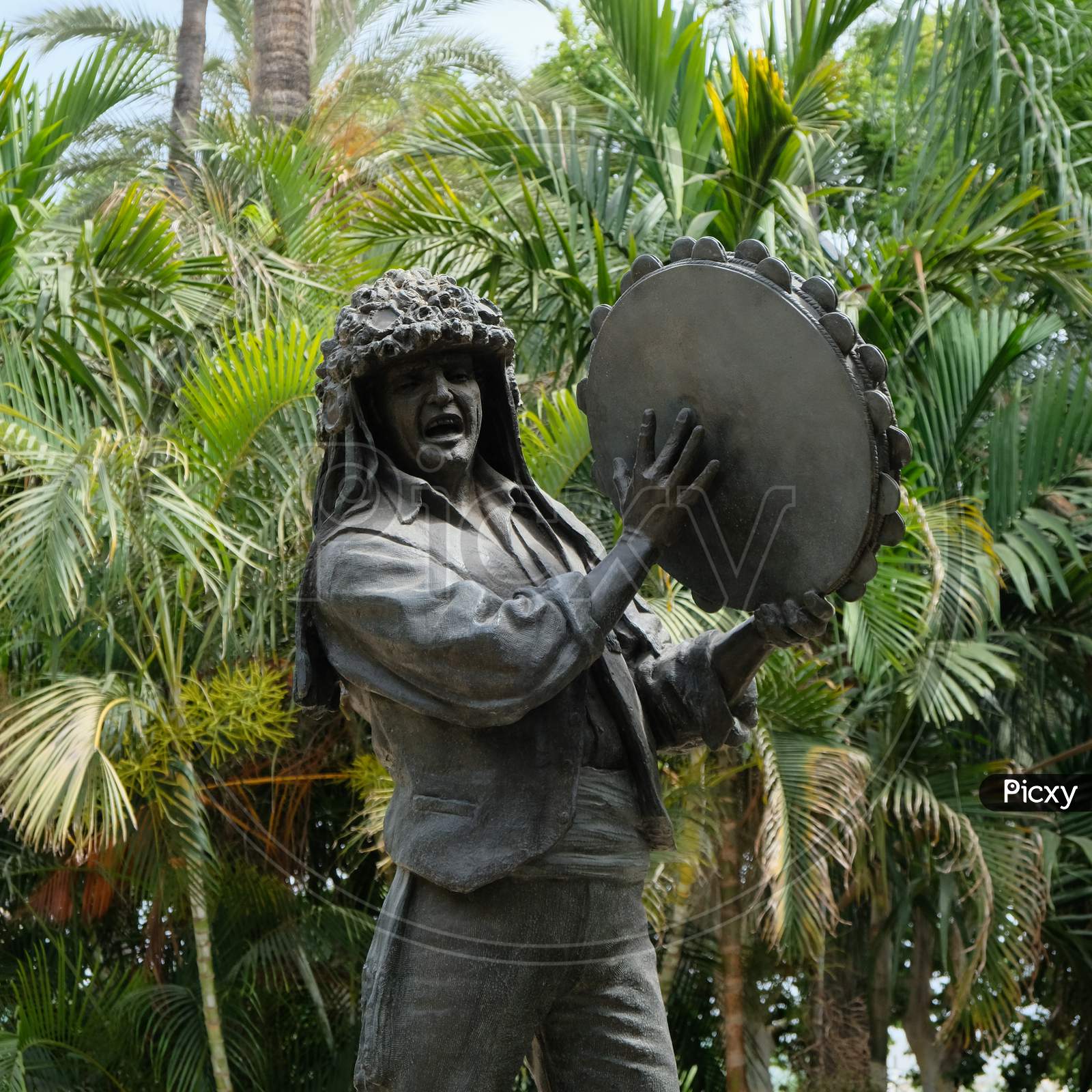 Malaga, Andalucia/Spain - July 5 : Statue Of Man Holding A Tamborine By Miguel Garcia Navas In Malaga Park  Costa Del Sol Spain On July 5, 2017