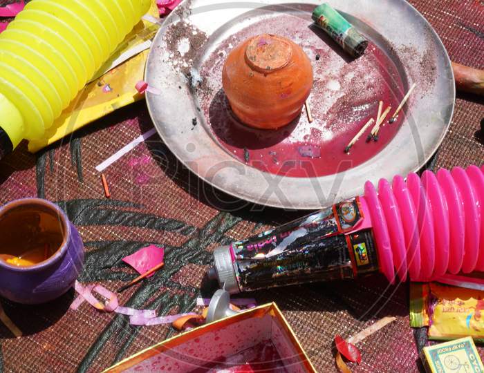 Remains Of A Party After The Hindu Festival Of Holi Showing The Mix Of Colors, Discarded Glasses, Water Guns And Other Bits And Pieces As This Water Filled Festival Ends