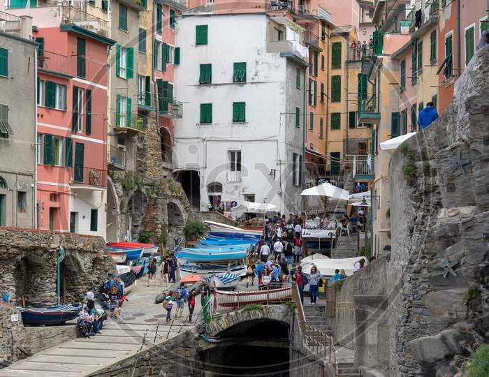 Riomaggiore, Liguria/Italy  - April 21 : Coastline View Of Riomaggiore Liguria Italy On April 21, 2019. Unidentified People
