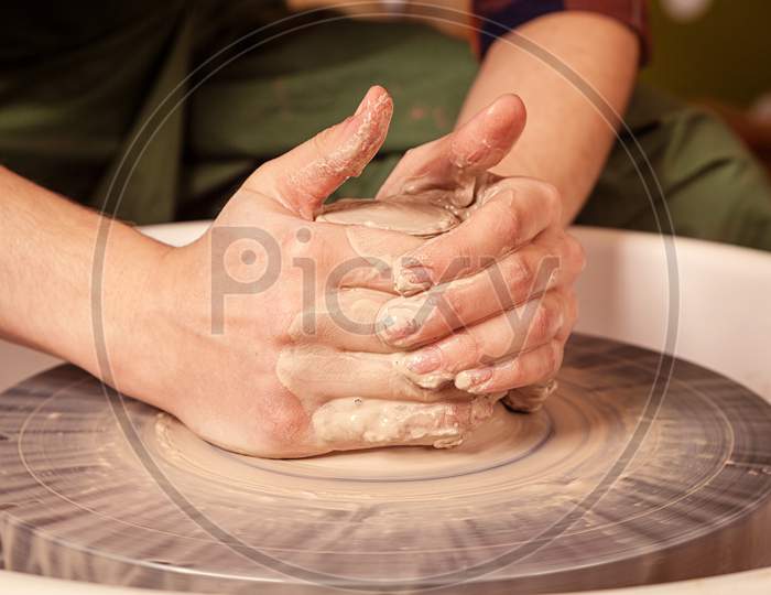 Woman Potter Sculpts A Clay