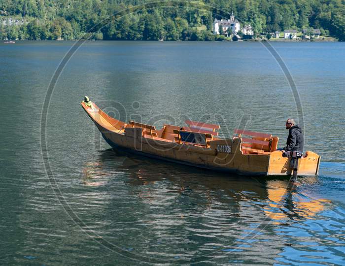 Traditional Flat Bottomed Boat On Lake Hallstatt