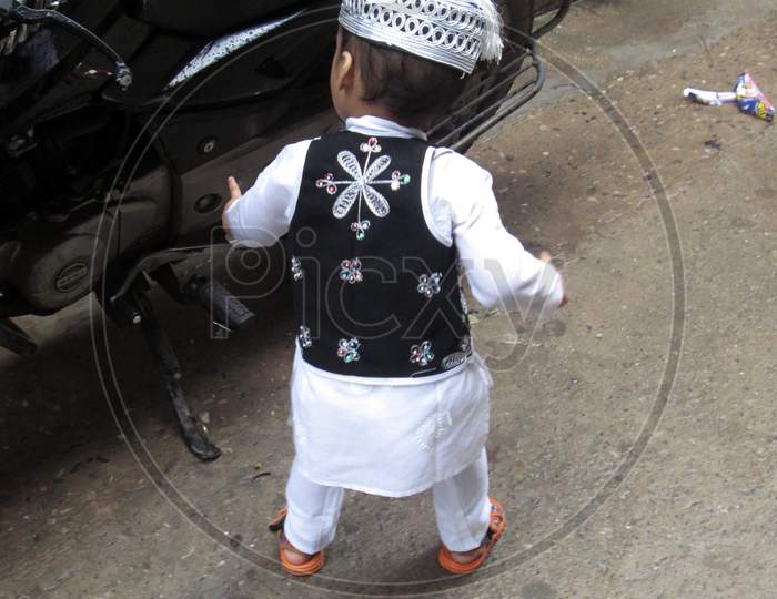 Indian Mohammedan walking in street on the occasion of Eid