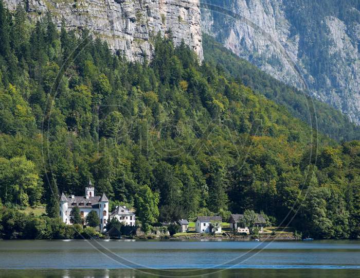 Castle Schloss On The Shoreline Of Lake Hallstatt