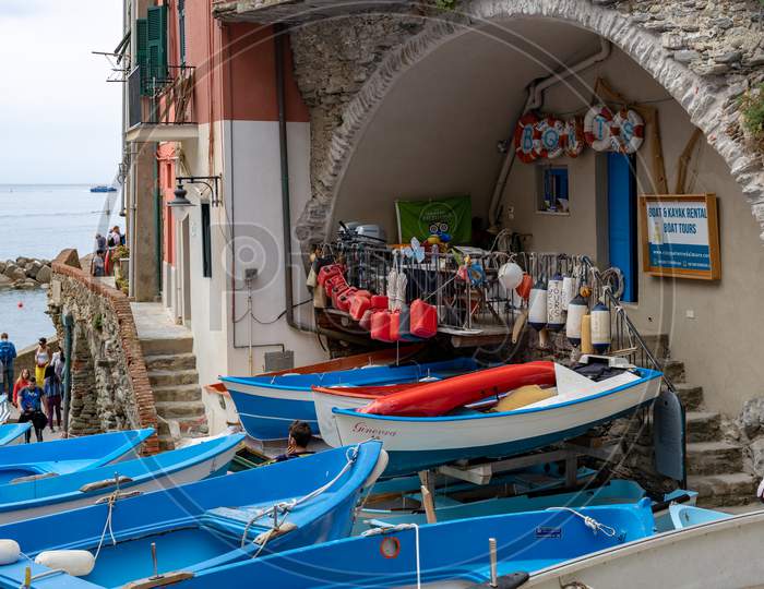 Riomaggiore, Liguria/Italy  - April 21 : Boats By The Sea In Riomaggiore Liguria Italy On April 21, 2019. Unidentified People