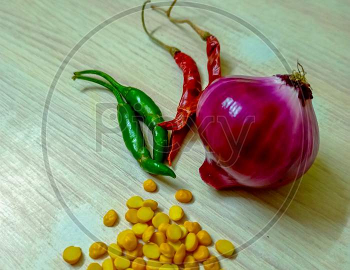 Fresh Vegetable Green Chillies Onion In Texture Background