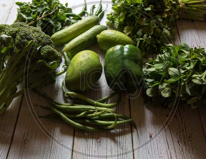 Healthy green vegetables on a background.