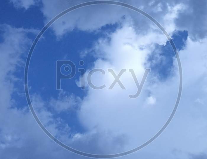 Sunny Day In Blue Sky With Nice White Clouds