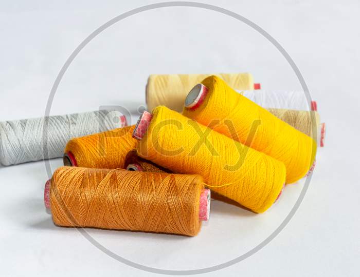 Sewing thread on white background hi-res stock photography and